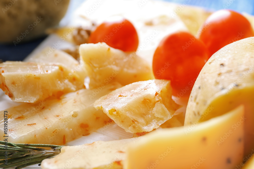 Composition with sliced cheese and tomatoes, closeup