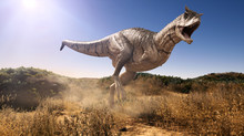 A 3d Rendering Of Carnotaurus Charging Through A Field.