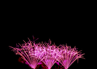 fireworks new year celebrate -  beautiful colorful firework isolated display with light reflex in water display for celebration happy new year and merry christmas on black isolated background