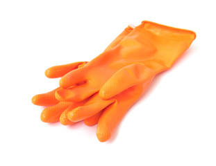 Orange color rubber gloves for cleaning on white background, housework concept