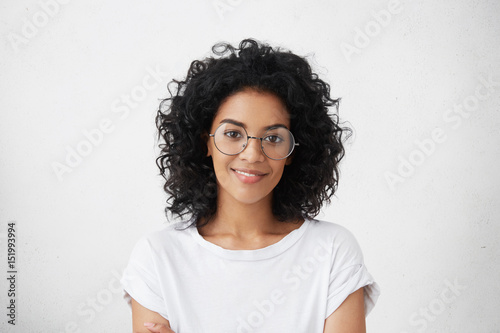 Fotografia Close up studio shot of beautiful young mixed race woman model with curly dark h