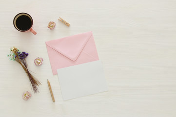 vintage mockup with flowers, cup of coffee and blank letter