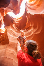 A Mother And Her Baby Son Visit Lower Antelope Canyon In Arizona