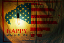 Memorial Day With Eagle In National Flag Colors On Fabric Illuminated By A Light Bulb