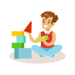 Sticker - Happy boy sitting and playing with colorful cubes. Cartoon character vector Illustration