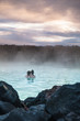 Relaxation concept.  Adult couple relaxing outdoor famous spa retreat in Blue Lagoon, Iceland.