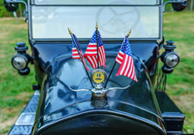 1924 Ford Model T Detail With Three American Flags / Essex, USA - August 2, 2011: 1924 Ford Model T With American Flags Flying On Display At Tuesday Evening Car Show On New England Village Green.