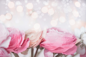 Wall Mural - Close up of Beautiful pastel flowers with bokeh light. Festive greeting card. Floral border.