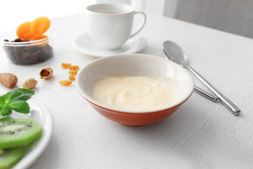 Wall Mural - Composition with tasty yogurt on kitchen table