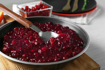 Wall Mural - Delicious cranberry sauce on kitchen table