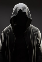 Mysterious Man In The Hood With Hidden Face Over Dark Grey Background