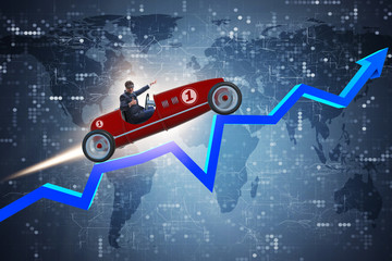 Wall Mural - Businessman riding sports car against charts