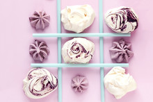 Tic Tac Toe Made By Meringues And Drinking Straws On Pink. Food Photo From Above