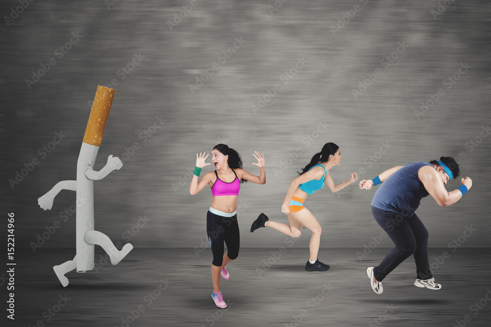 cigarettes and running People running away by a cigarette Stock Photo