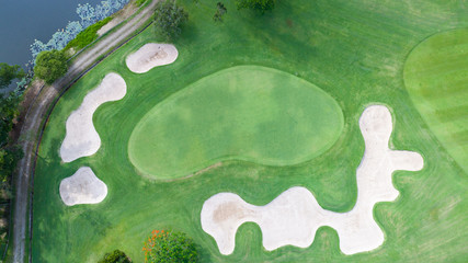 Green golf course/outdoor green grass field. Aerial view from flying drone