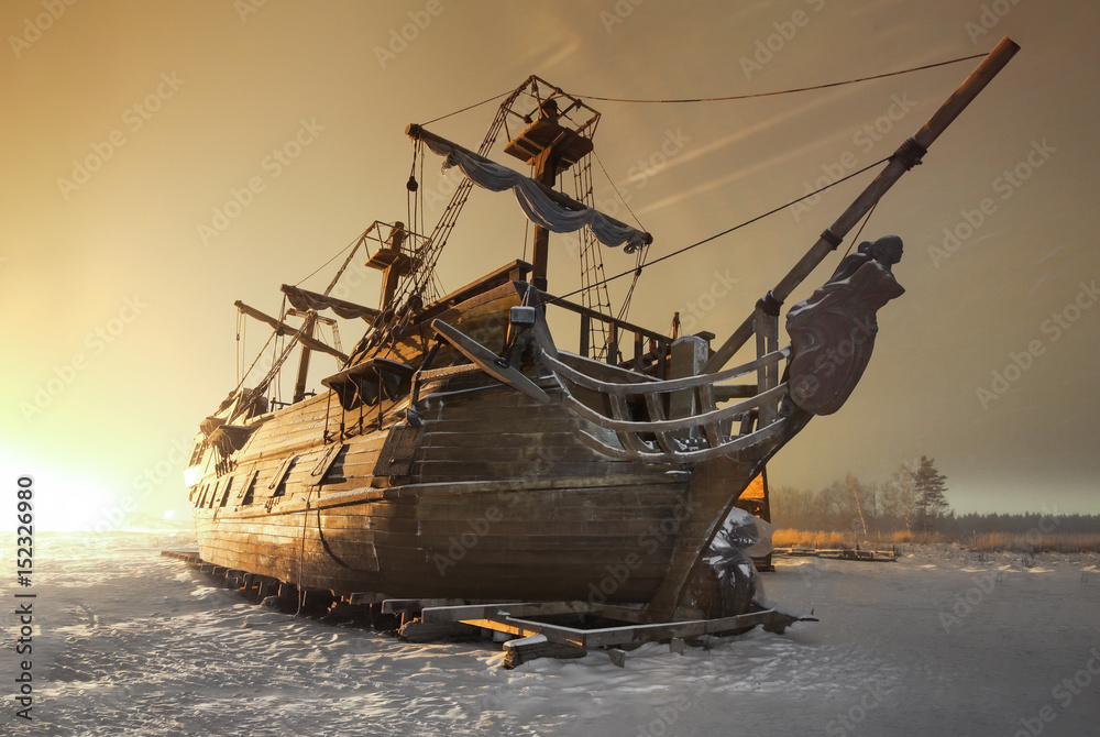 Vintage wooden sailing ship night on the snow in the field - obrazy, fototapety, plakaty 