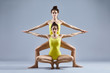 © GVS - Two beautiful women doing partner yoga asana