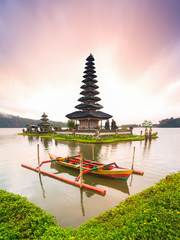 a beautiful sunrise at pura ulun danu bratan temple, one of famous tourist attraction in bali , indo