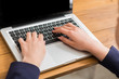 © Prostock-studio - Business woman using laptop at workplace, close-up