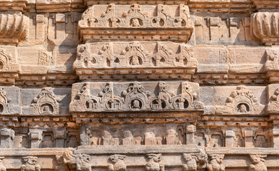 Wall Mural - Ancient design of stone relief on wall of 7th century temple in Pattadakal of Karnataka, India. UNESCO World Heritage site with stone carved temples