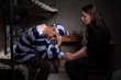 © kolotype - Male prisoner sitting on a bed and holding his wife hand, who came to visit him