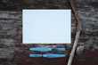 White paper sheet and water brashes on the wooden table outdoors