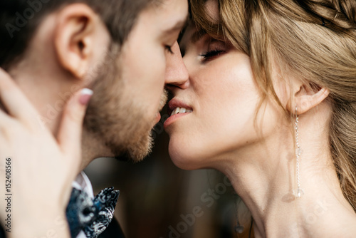 man and woman kissing on the lips