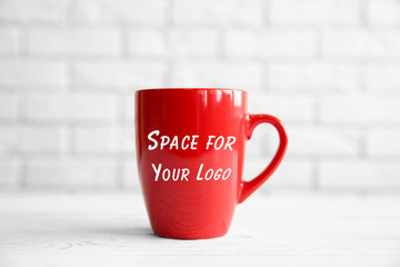 Canvas Print - Blank cup with space for logo on blurred background