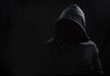 Unknown person concept.Hooded silhouette on black, with no face