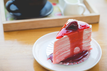 strawberry crapecake with strawberry sauce. strawberry crape cake in cozy outdoor cafe.(selective focus)