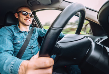 Wall Mural - Man drives a car - inside wide angle view