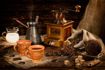 Poster - still life with coffee beans and old coffee mill on the wooden background