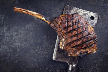 Wall Mural - Barbecue dry aged Wagyu Tomahawk Steak as close-up on old metal sheet