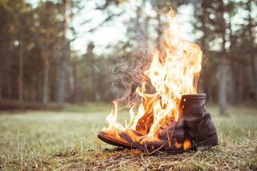 Burning shoes. Abstract composition of shoes on fire