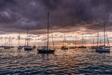 Fototapeta Niebo - Sailboats at sunset in the sea