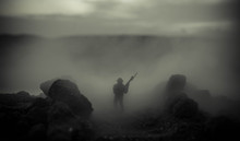 War Concept. Military Silhouettes Fighting Scene On War Fog Sky Background, World War Soldiers Silhouettes Below Cloudy Skyline At Night. Attack Scene. Armored Vehicles. Tanks Battle