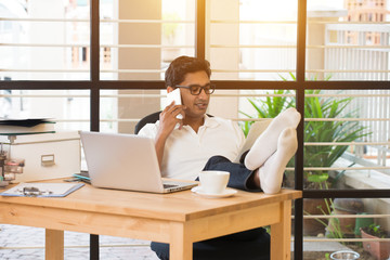 Wall Mural - indian business male on phone conversation