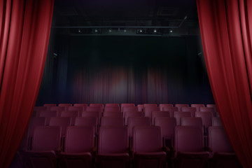 open curtain theater before showtime , empty auditorium with seats