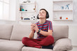 © Prostock-studio - Teenage boy enjoying music in headphones at home