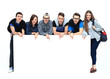 © ASDF - Full length portrait of confident college students displaying blank billboard against white background
