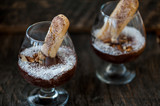 Fototapeta Na sufit - Chocolate souffle with coconut flakes in a glass
