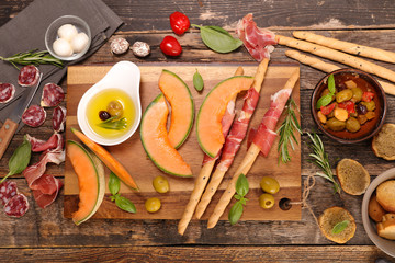 Wall Mural - antipasti with melon,olive and meats