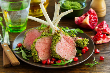 Canvas Print - Rack of lamb in herb cheese and breadcrumbs. A festive meal. Selective focus.