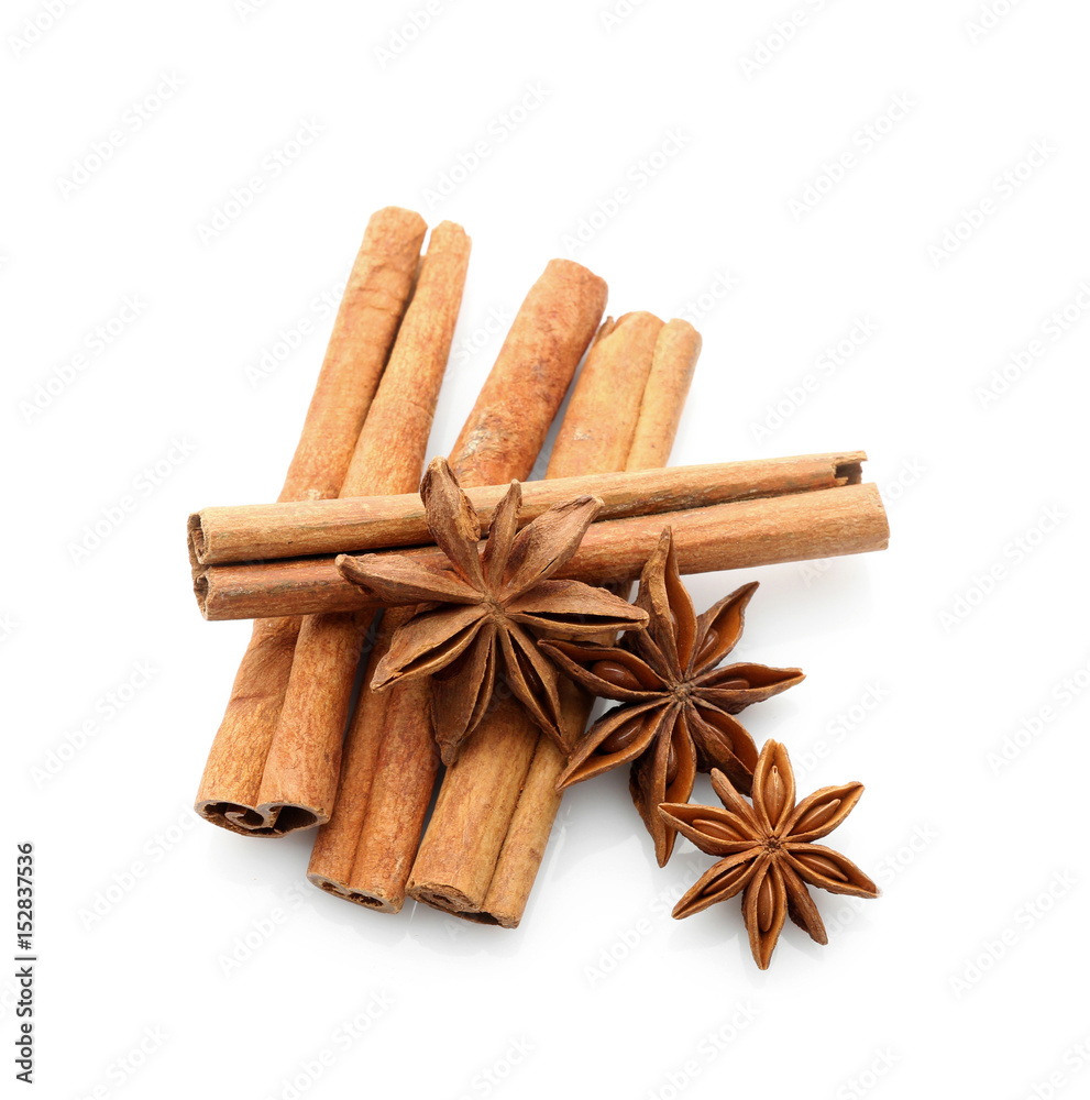 Cinnamon sticks with anise stars isolated on white, top view