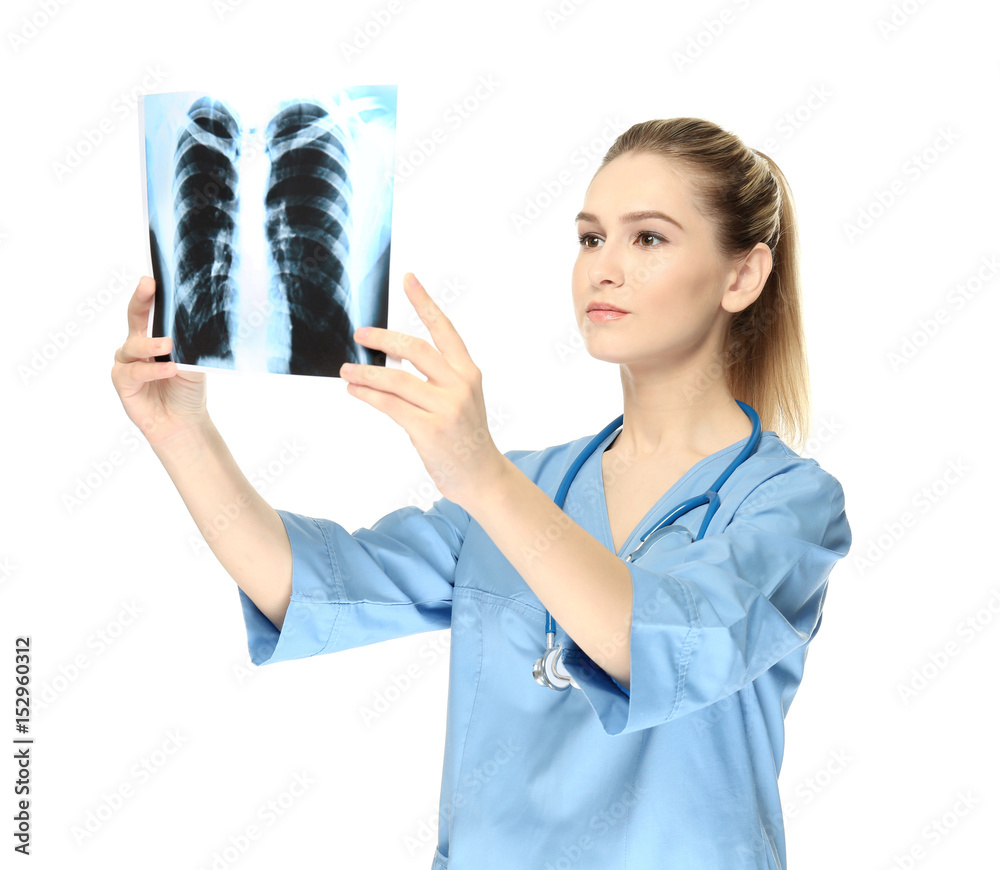 Young medical assistant with x-ray image on white background