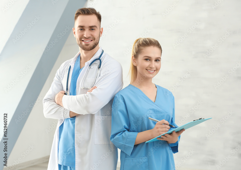 Doctor and medical assistant in clinic