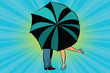Man and woman kissing behind umbrella
