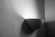 Bowl shaped sconce in corner with light shining up