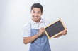 © Odua Images - Small business shop owner with black board