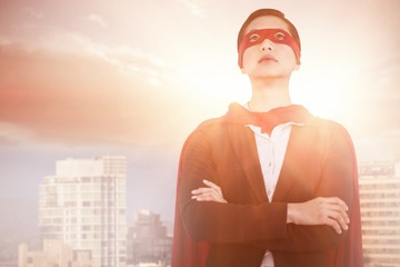 Poster - Composite image of confident woman pretending to be super hero